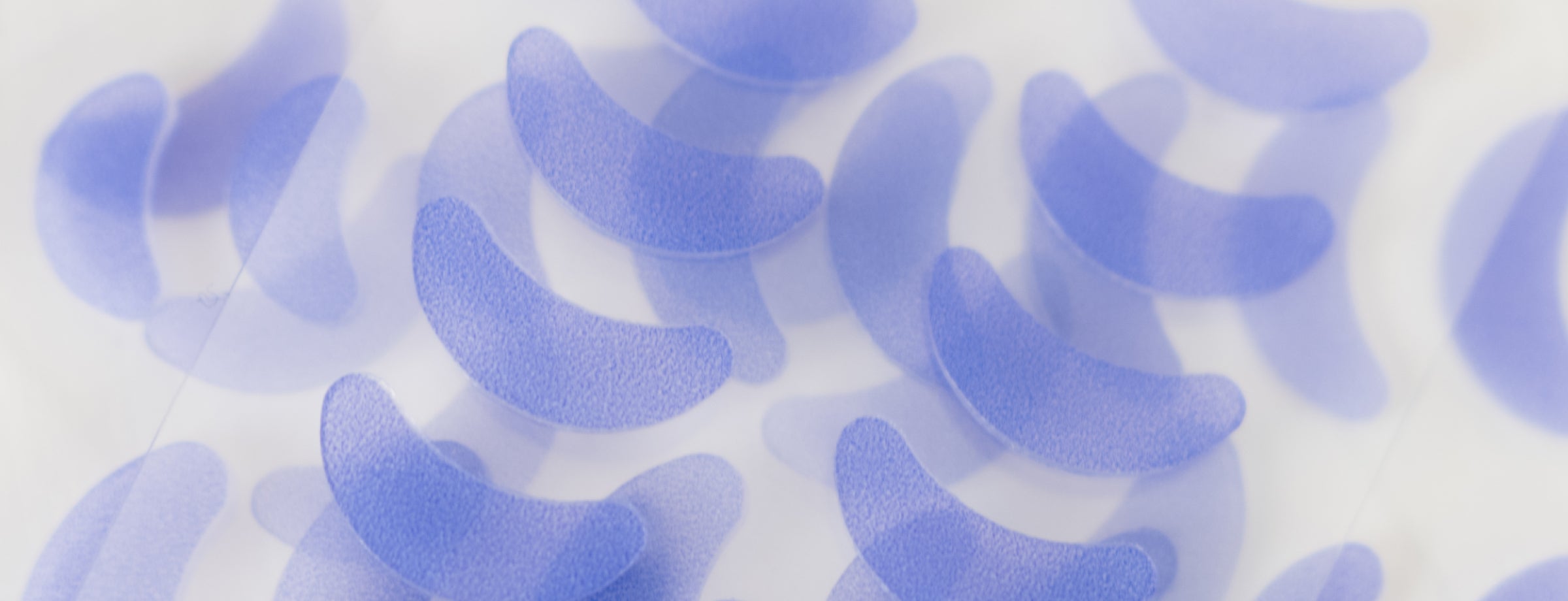 Close up of French Lilac Cutipatch cuticle patches on a white background